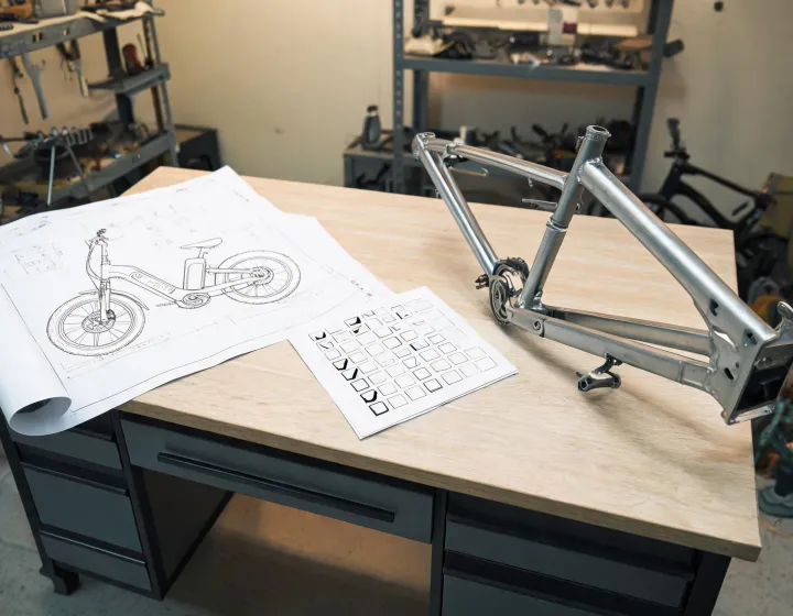 Procurement notes alongside an unbranded electric bicycle